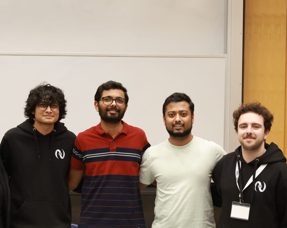 The winners of TacOps 2026, The High Table, along with the Netsoc president.